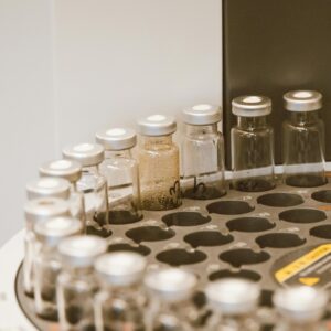 Company Vials arranged in a lab rack, showcasing scientific organization and research preparation.